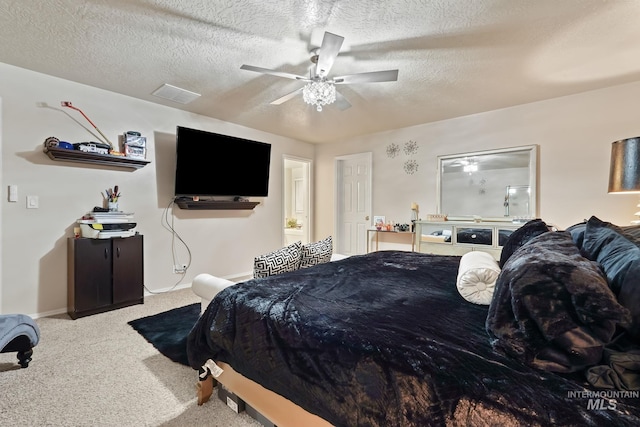 bedroom with a ceiling fan, baseboards, carpet, visible vents, and a textured ceiling