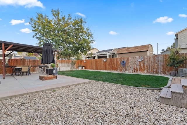 view of yard with a patio area and a fenced backyard