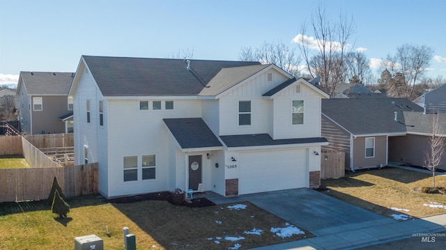 front of property with a garage and a front yard