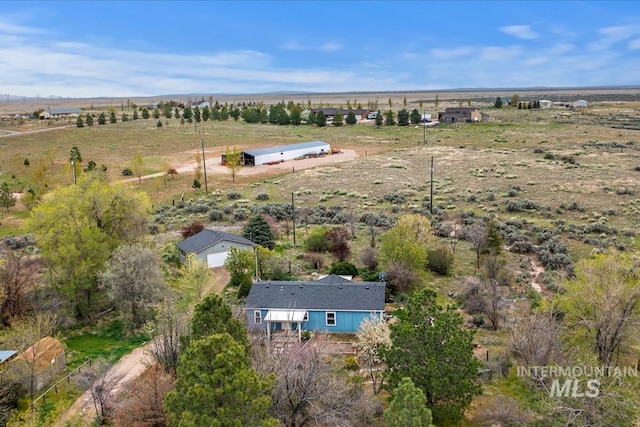 birds eye view of property featuring a rural view