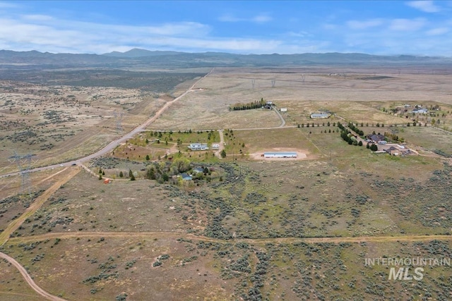 bird's eye view featuring a rural view and a mountain view