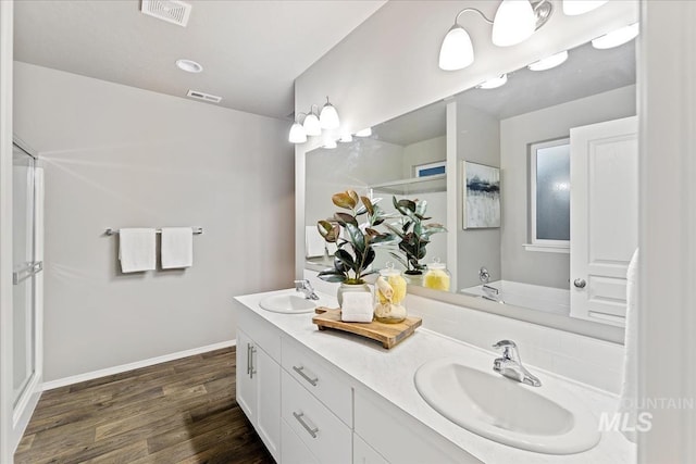 bathroom featuring hardwood / wood-style flooring and vanity