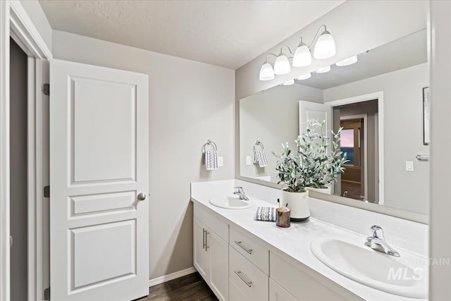 bathroom with vanity and hardwood / wood-style flooring