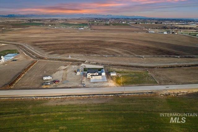 aerial view at dusk with a rural view