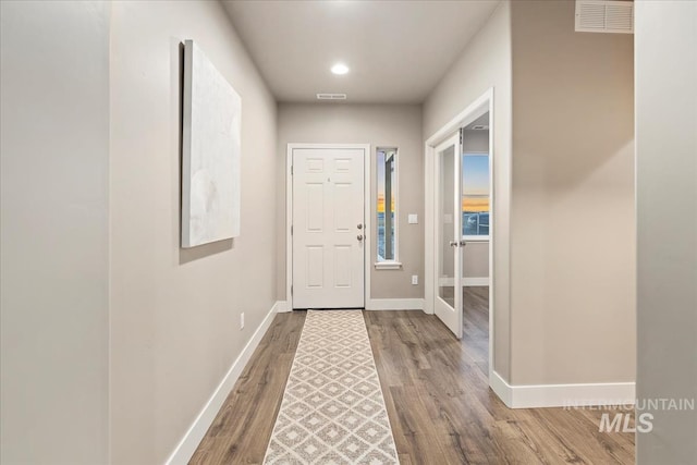 doorway to outside featuring hardwood / wood-style floors