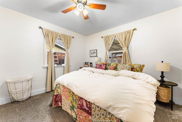 bedroom featuring baseboards, carpet flooring, and ceiling fan