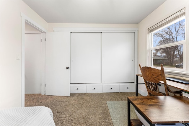 carpeted bedroom with a closet
