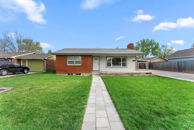 view of front of home with fence, a chimney, driveway, and a front yard