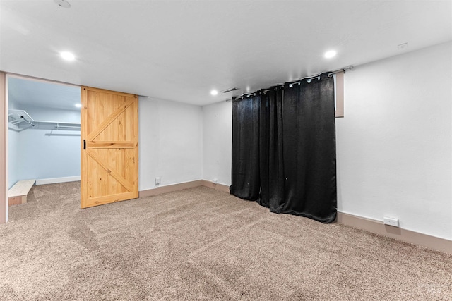 interior space with carpet floors, recessed lighting, baseboards, and visible vents