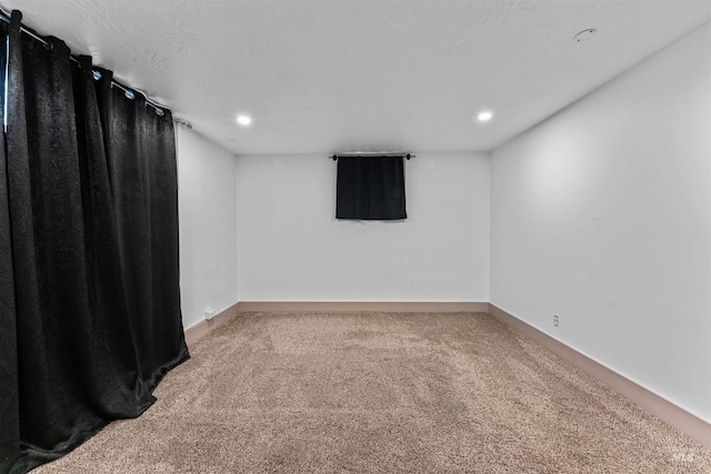 unfurnished room with carpet floors, recessed lighting, and baseboards