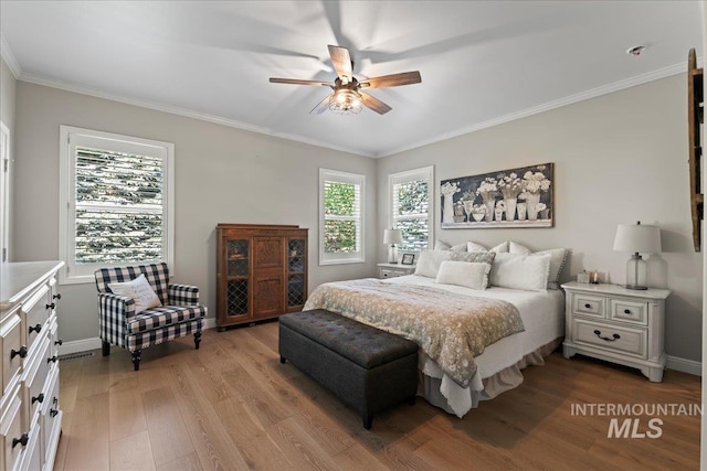 bedroom with ceiling fan, light hardwood / wood-style flooring, and ornamental molding