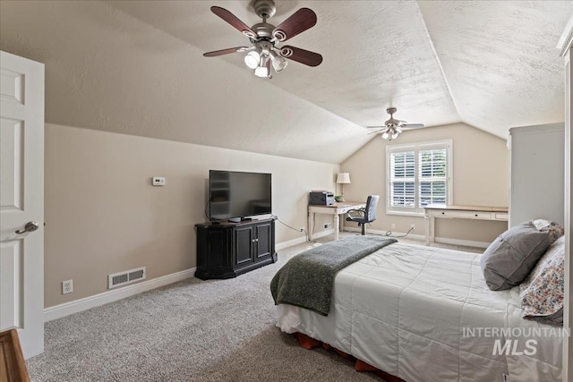 carpeted bedroom featuring a textured ceiling, ceiling fan, and lofted ceiling