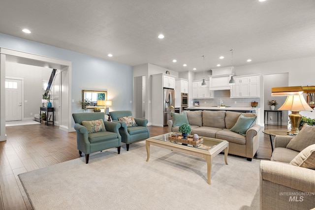 6922 N Agrarian, Meridian, ID 83646 - living room featuring recessed lighting, baseboards, light wood-style floors, and plenty of natural light