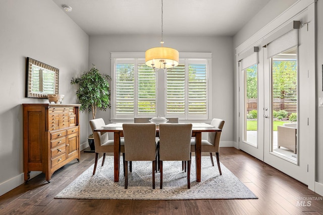 6922 N Agrarian, Meridian, ID 83646 - dining room featuring a chandelier, baseboards, and dark wood-type flooring