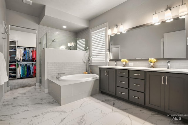 6922 N Agrarian, Meridian, ID 83646 - bathroom with a shower stall, double vanity, a garden tub, marble finish floors, and a spacious closet