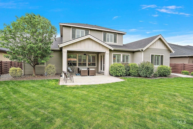 6922 N Agrarian, Meridian, ID 83646 - back of property featuring board and batten siding, ceiling fan, a patio, and roof with shingles