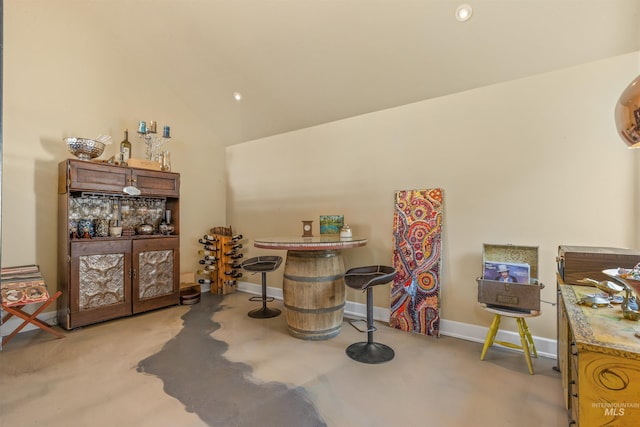 miscellaneous room with light carpet and lofted ceiling