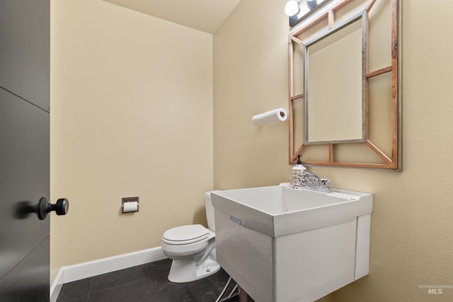 bathroom with tile patterned floors, toilet, and vanity