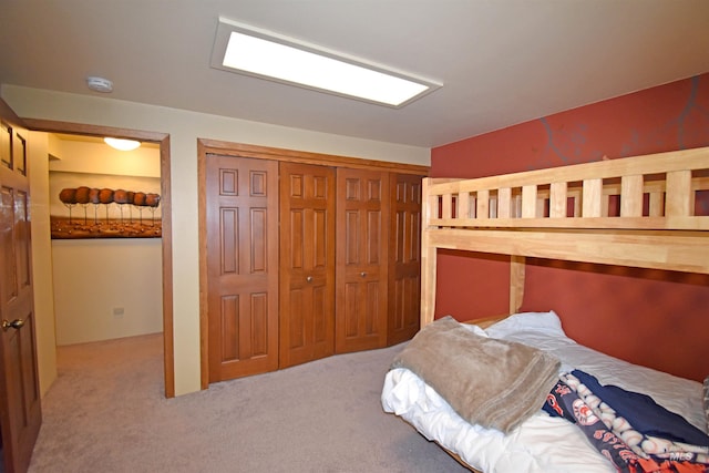 carpeted bedroom with a closet