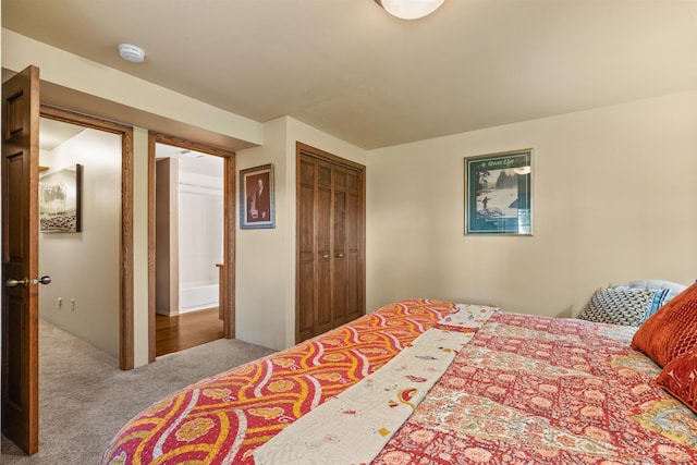 bedroom featuring a closet and carpet flooring