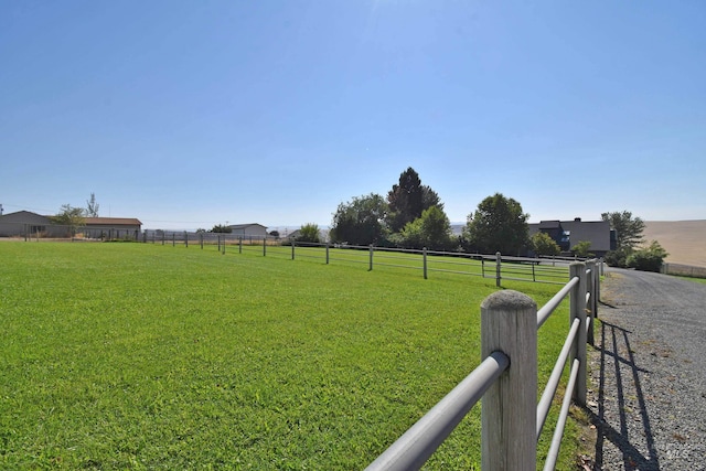 view of yard with a rural view