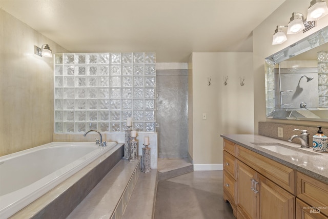 bathroom with vanity, concrete flooring, and a washtub