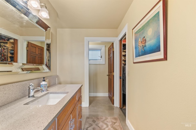 bathroom with vanity and concrete floors