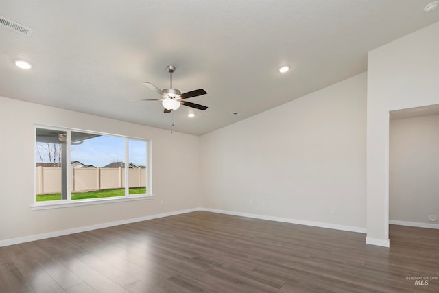 empty room featuring ceiling fan and dark hardwood / wood-style floors