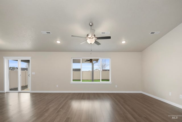 empty room featuring ceiling fan and dark wood-type flooring