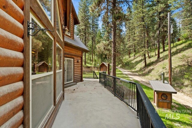 view of patio / terrace with an outbuilding