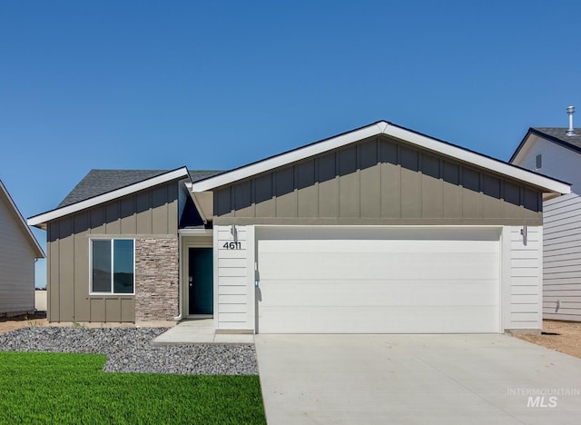 ranch-style house featuring a garage