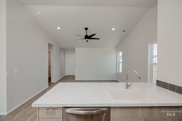 kitchen with light brown cabinets, ceiling fan, dishwasher, light hardwood / wood-style floors, and sink