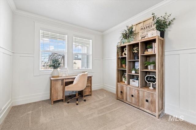 office area with light carpet, ornamental molding, wainscoting, and a decorative wall