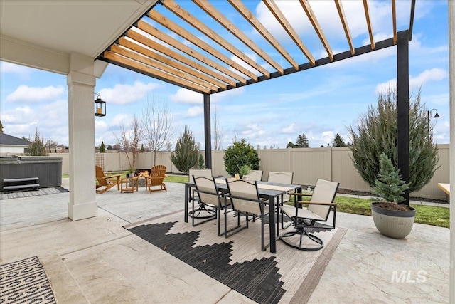 view of patio with a hot tub, a pergola, a fenced backyard, and outdoor dining space