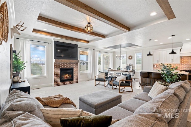 living area with a healthy amount of sunlight and a textured ceiling