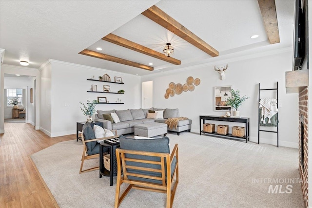 living area with baseboards, light wood-style flooring, ornamental molding, beam ceiling, and recessed lighting