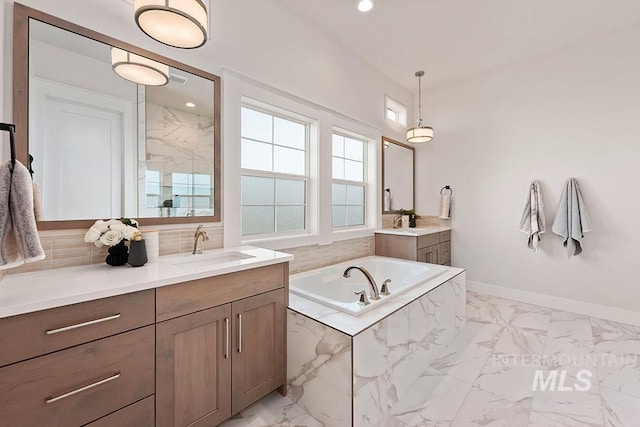 811 N Creekwater Lot 13/6, Eagle, ID 83616 - bathroom featuring marble look tile flooring, healthy amount of natural light, two vanities, and recessed lighting