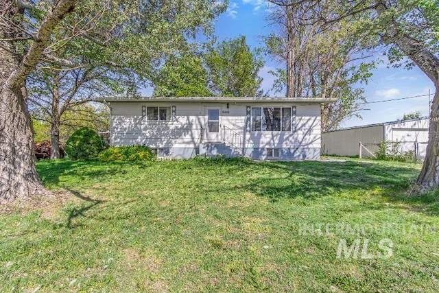 9446 Robinson, Kuna, ID 83634 - rear view of property featuring a lawn