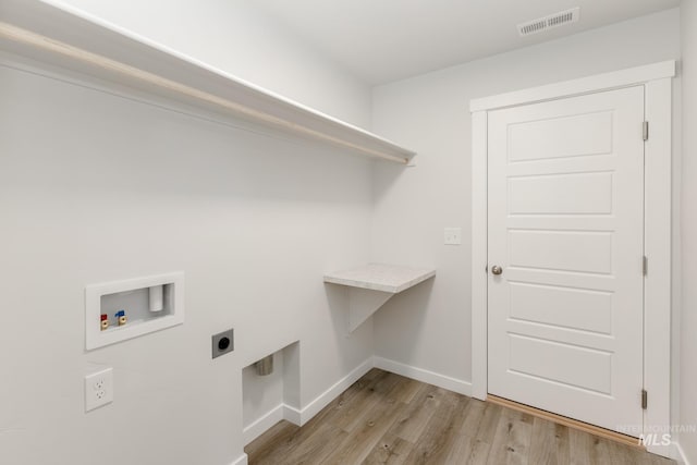 washroom featuring laundry area, visible vents, light wood-style flooring, hookup for a washing machine, and electric dryer hookup