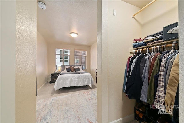 carpeted bedroom with a closet