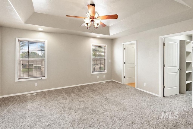 720 E Main St, Jerome, ID 83338 - unfurnished bedroom featuring a raised ceiling, carpet, baseboards, recessed lighting, and a ceiling fan