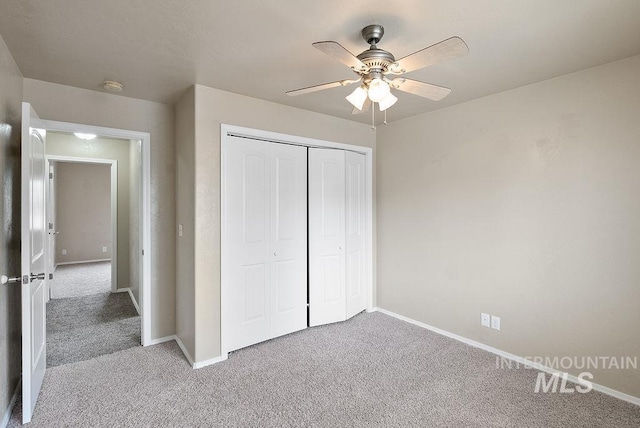 720 E Main St, Jerome, ID 83338 - unfurnished bedroom with carpet floors, baseboards, a closet, and a ceiling fan
