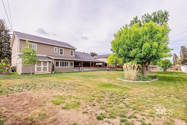720 E Main St, Jerome, ID 83338 - view of yard featuring a storage shed and an outbuilding