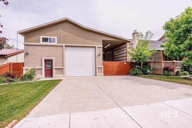720 E Main St, Jerome, ID 83338 - view of front of home with driveway, stucco siding, and an attached garage