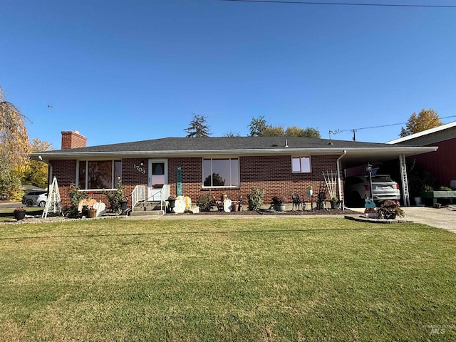 single story home with a front yard and a carport