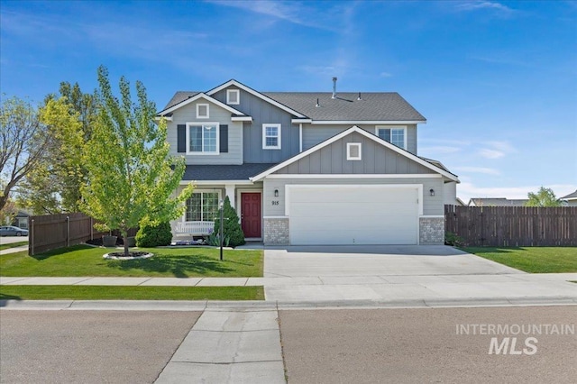 915 Ione Ave, Middleton, ID 83644 - craftsman-style home with fence, driveway, a garage, a front lawn, and board and batten siding
