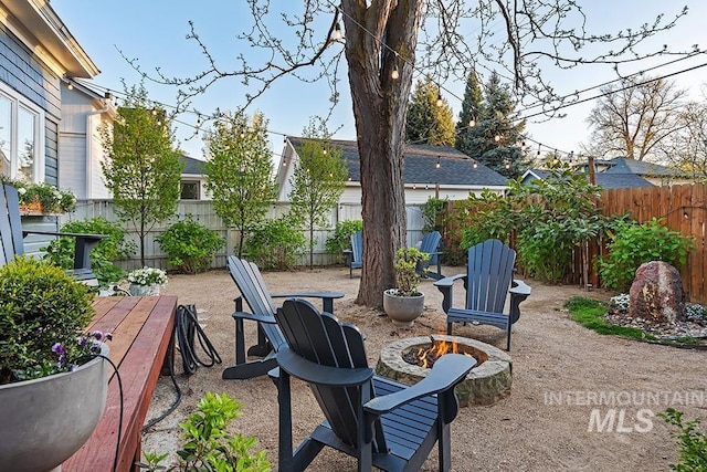 view of patio / terrace with a fire pit and a fenced backyard