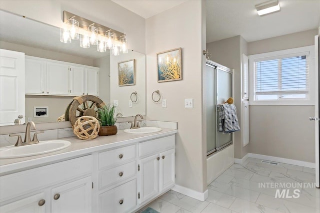 full bath with a sink, baseboards, bath / shower combo with glass door, and marble finish floor
