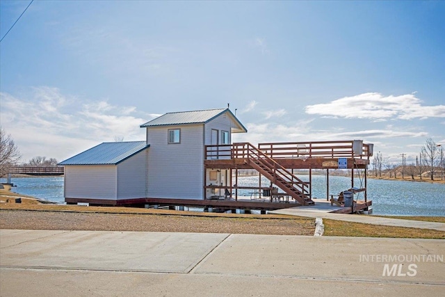 view of dock with stairs and a water view