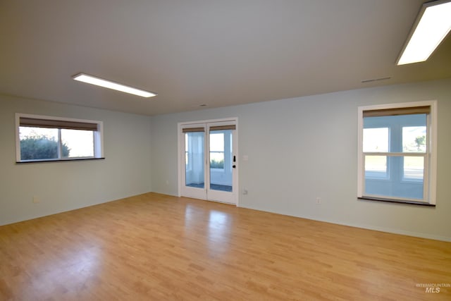 spare room featuring light wood-type flooring